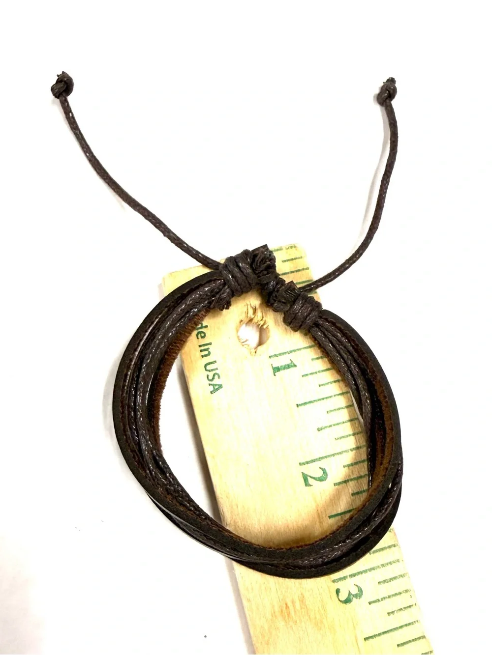 Brown leather unisex bracelet with braided rope accents and ties nsb